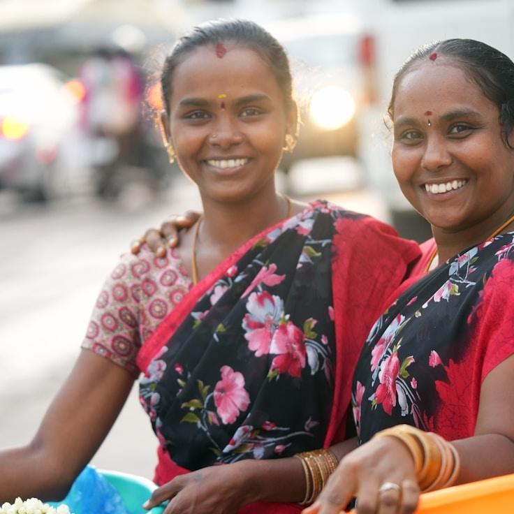 Kaveri Mehta, Lead Design Curator at GladeHarborTrail, reviewing corporate floral arrangements